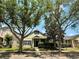 Inviting single-Gathering home featuring mature trees, lush landscaping, and lovely curb appeal at 14479 Tanja King Blvd, Orlando, FL 32828