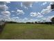 Sprawling green lawn with blue skies, perfect for recreational activities, events, or community gatherings at 14479 Tanja King Blvd, Orlando, FL 32828