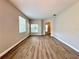 Open-concept living space filled with lots of natural light and stylish laminate wood flooring at 14479 Tanja King Blvd, Orlando, FL 32828