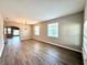 Spacious living room with lots of natural light and stylish laminate wood flooring at 14479 Tanja King Blvd, Orlando, FL 32828
