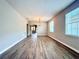 Inviting living room featuring laminate wood flooring, lots of natural light, and neutral paint at 14479 Tanja King Blvd, Orlando, FL 32828