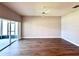 Bright living room with sliding glass doors leading to a lanai and wood laminate flooring at 14479 Tanja King Blvd, Orlando, FL 32828