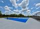 Bright blue pickleball courts offer a fun outdoor activity with expansive cloudy skies above at 14479 Tanja King Blvd, Orlando, FL 32828