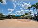 Splash pad with colorful play structures, seating areas, and picnic tables for community enjoyment at 14479 Tanja King Blvd, Orlando, FL 32828