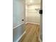 Walk-in closet boasts wood look floors and plenty of storage with wire shelving at 14479 Tanja King Blvd, Orlando, FL 32828