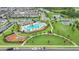 Aerial view of a community pool, playground, and green space in a well-maintained neighborhood at 15060 Book Club Rd, Winter Garden, FL 34787