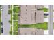 Aerial view of townhomes showing roof lines, landscaping, and parking, creating a cohesive community aesthetic at 15060 Book Club Rd, Winter Garden, FL 34787