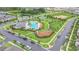 Aerial view of a community pool, playground, and recreational area, surrounded by lush landscaping at 15060 Book Club Rd, Winter Garden, FL 34787