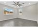 Bright bedroom with laminate flooring, ceiling fan and windows offering natural light at 15060 Book Club Rd, Winter Garden, FL 34787