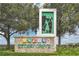 Attractive community sign that says Storey Grove with greenery and trees surrounding the entrance at 15060 Book Club Rd, Winter Garden, FL 34787