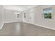 Open-concept living room with laminate flooring, chandelier, and multiple windows for natural light at 15060 Book Club Rd, Winter Garden, FL 34787