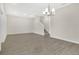 Open-concept living room with laminate flooring and a chandelier at 15060 Book Club Rd, Winter Garden, FL 34787