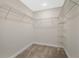 Walk-in closet with carpet and multiple wire shelves for optimal storage space at 15060 Book Club Rd, Winter Garden, FL 34787