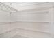 Bright walk-in closet with multiple wire shelves for storage at 15060 Book Club Rd, Winter Garden, FL 34787