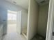 Bright bathroom featuring a doorway to the shower and views of the neighborhood at 15345 Burgtheater Dr, Winter Garden, FL 34787