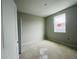 Small bedroom featuring one window and a door at 15345 Burgtheater Dr, Winter Garden, FL 34787
