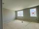 Bright bedroom with two windows offering pleasant views of the neighborhood at 15345 Burgtheater Dr, Winter Garden, FL 34787