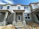 New construction townhome featuring a covered porch and modern architectural details at 15345 Burgtheater Dr, Winter Garden, FL 34787