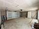 Spacious garage with concrete block walls, a large garage door, and a side door at 15345 Burgtheater Dr, Winter Garden, FL 34787
