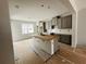 Modern kitchen features white subway tile backsplash, a spacious island, and gray cabinets at 15345 Burgtheater Dr, Winter Garden, FL 34787