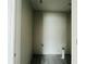 A simple laundry room with gray floors, white walls, and essential plumbing fixtures at 15345 Burgtheater Dr, Winter Garden, FL 34787