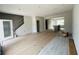 Spacious living room featuring stairs to the second floor and an opening to the kitchen area at 15345 Burgtheater Dr, Winter Garden, FL 34787