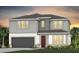 Charming two-story home featuring a two-car garage, neutral paint palette, and a well manicured lawn at 1536 Groveline Rd, St Cloud, FL 34771