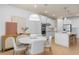 Bright kitchen and dining area with stainless steel appliances and white cabinetry at 1536 Groveline Rd, St Cloud, FL 34771
