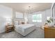 Serene main bedroom with large window and stylish decor at 1536 Groveline Rd, St Cloud, FL 34771