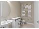 Stylish powder room with modern fixtures and decorative mirror at 1536 Groveline Rd, St Cloud, FL 34771