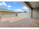 Open backyard patio area with a white fence ensuring privacy and outdoor living space at 15477 Blackbead St, Winter Garden, FL 34787