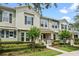 Street view of two story home featuring a covered porch and well-maintained landscaping at 15477 Blackbead St, Winter Garden, FL 34787