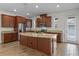 Modern kitchen with stainless steel appliances, granite countertops, and a large center island at 15477 Blackbead St, Winter Garden, FL 34787