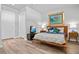 Modern bedroom with a queen bed, side tables, and television at 155 S Court Ave # 2406, Orlando, FL 32801