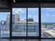 Breathtaking city skyline view from the balcony through sliding glass doors at 155 S Court Ave # 2406, Orlando, FL 32801