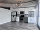 Modern kitchen features stainless appliances, white cabinets, with open floor plan at 155 S Court Ave # 2406, Orlando, FL 32801