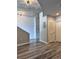Open-concept living area featuring laminate floors, exposed concrete ceiling, and a modern design at 155 S Court Ave # 2406, Orlando, FL 32801