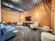 Stylish lounge area featuring modern furniture, a large TV, and unique lighting fixtures at 155 S Court Ave # 2406, Orlando, FL 32801