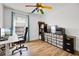 Bedroom with a modern desk and a large window for ample natural light at 1552 Whooping Dr, Groveland, FL 34736