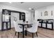 Dining room with decorative furniture, modern lighting, and hardwood flooring at 1552 Whooping Dr, Groveland, FL 34736