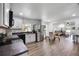 Bright kitchen with stainless steel appliances, white cabinets, and open layout at 1552 Whooping Dr, Groveland, FL 34736