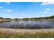 Scenic lake view from the property, showcasing natural beauty and tranquility at 1552 Whooping Dr, Groveland, FL 34736