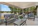 Relaxing screened porch with comfortable seating overlooking scenic lake views at 1552 Whooping Dr, Groveland, FL 34736