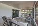 Cozy screened-in porch area with comfortable seating and outdoor access at 1552 Whooping Dr, Groveland, FL 34736