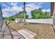 Private backyard featuring a tiled patio and white vinyl fence at 15628 Hidden Lake Cir, Clermont, FL 34711