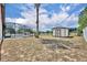 Fenced backyard with an outbuilding at 15628 Hidden Lake Cir, Clermont, FL 34711