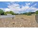 Expansive backyard featuring a fire pit and expansive green space at 15628 Hidden Lake Cir, Clermont, FL 34711