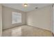Cozy bedroom with tile floors, neutral walls, and a bright window at 15628 Hidden Lake Cir, Clermont, FL 34711