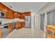 Well-equipped kitchen featuring stainless steel appliances, with direct access to the patio at 15628 Hidden Lake Cir, Clermont, FL 34711