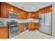 Updated kitchen features stainless steel appliances and classic cabinetry at 15628 Hidden Lake Cir, Clermont, FL 34711